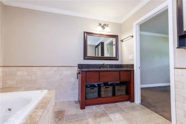 bathroom featuring a tub with jets, tile walls, vanity, and crown molding