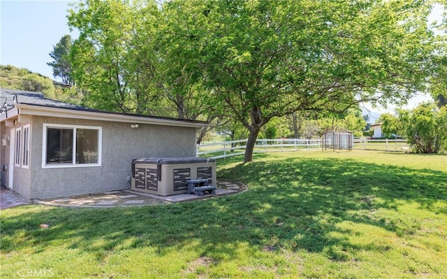 view of yard featuring an outdoor structure and a fenced backyard