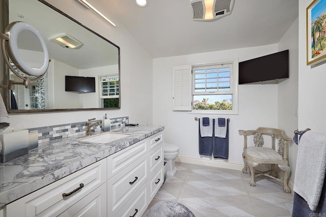 6019 La Flecha, Rancho Santa Fe, CA 92067 - bathroom featuring toilet, baseboards, vanity, and vaulted ceiling