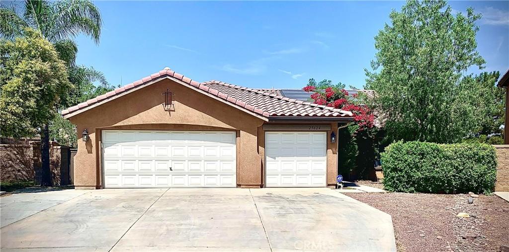 garage featuring driveway