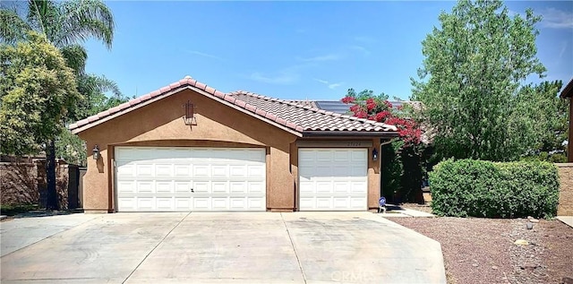 garage featuring driveway