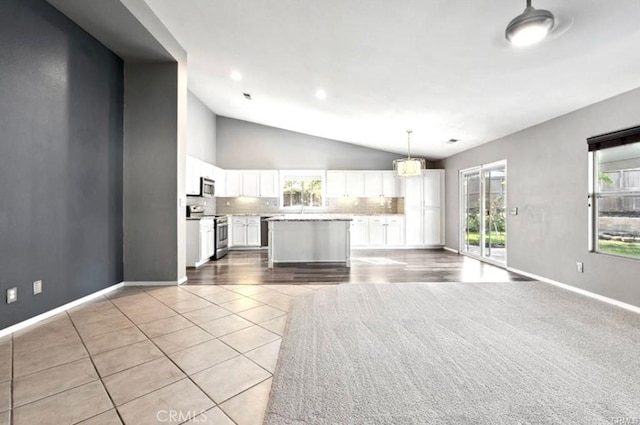 25624 Driftview Cir, Menifee, CA 92584 - unfurnished living room with lofted ceiling, light tile patterned floors, and baseboards