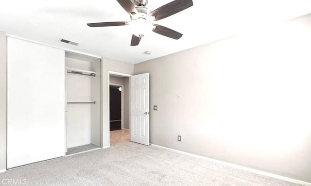25624 Driftview Cir, Menifee, CA 92584 - unfurnished bedroom featuring light colored carpet, a closet, a ceiling fan, and baseboards