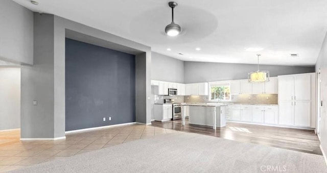 25624 Driftview Cir, Menifee, CA 92584 - living room featuring light carpet, baseboards, light tile patterned flooring, recessed lighting, and high vaulted ceiling