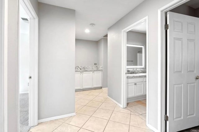 25624 Driftview Cir, Menifee, CA 92584 - hallway with light tile patterned floors and baseboards