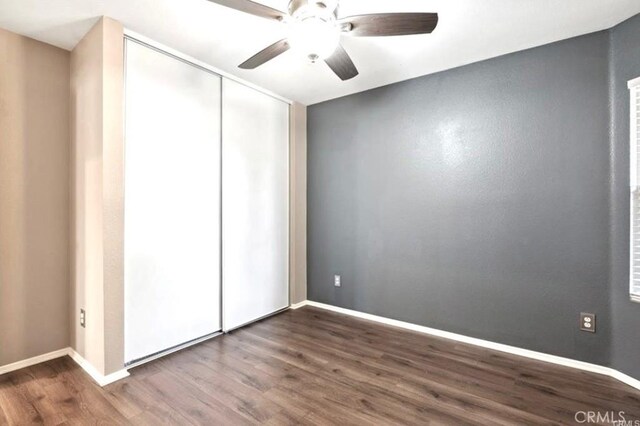 25624 Driftview Cir, Menifee, CA 92584 - unfurnished bedroom with wood finished floors, a closet, baseboards, and ceiling fan