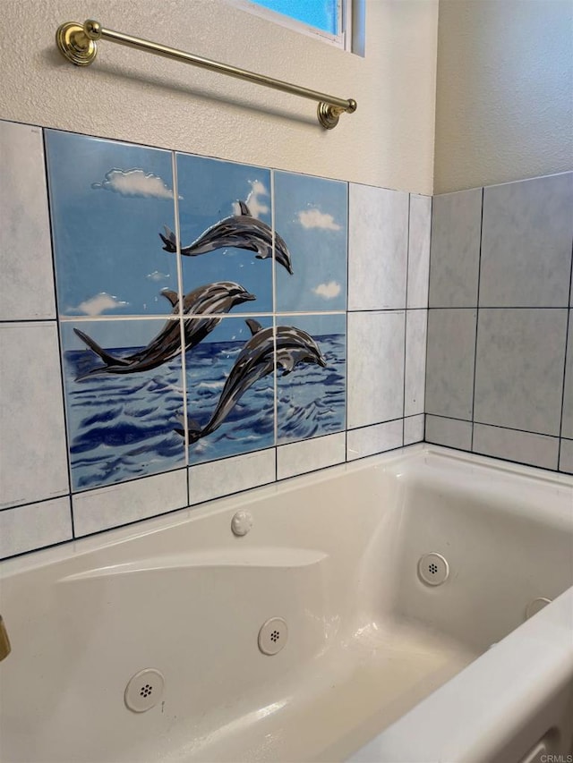 full bathroom featuring a jetted tub