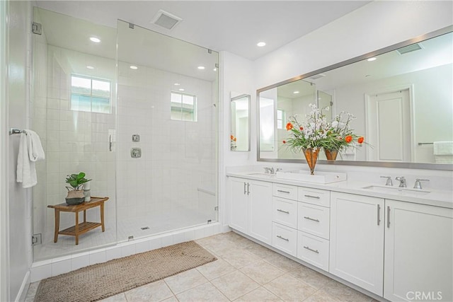 12931 Lotus St, Garden Grove, CA 92840 - full bathroom featuring double vanity, tile patterned floors, a stall shower, and a sink
