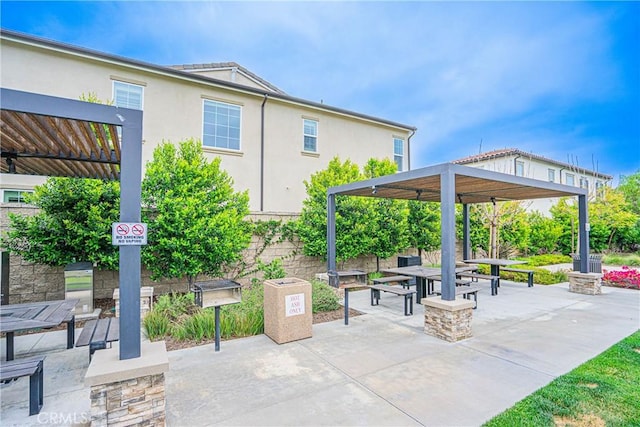 12931 Lotus St, Garden Grove, CA 92840 - view of home's community with outdoor dining area, a patio, and a pergola