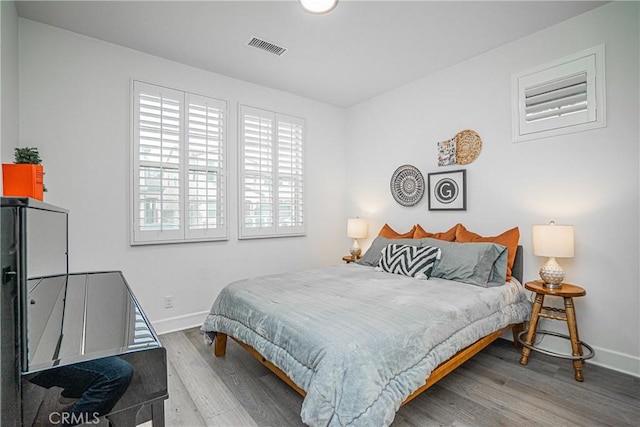 12931 Lotus St, Garden Grove, CA 92840 - bedroom featuring baseboards, visible vents, and wood finished floors