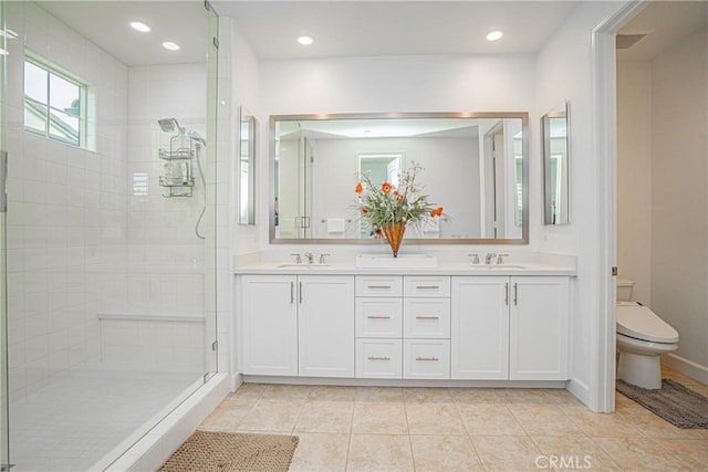 12931 Lotus St, Garden Grove, CA 92840 - bathroom featuring a stall shower, tile patterned floors, toilet, and a sink
