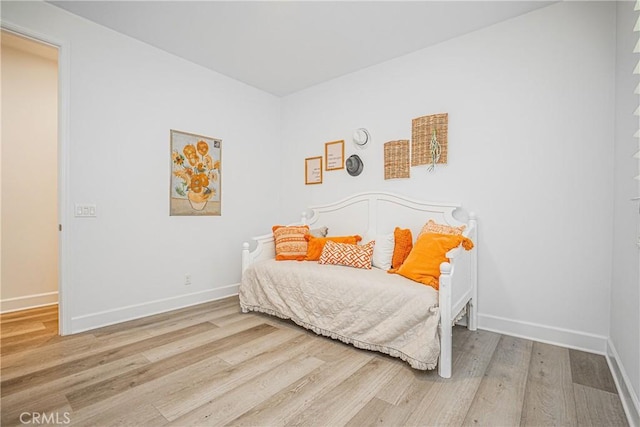 12931 Lotus St, Garden Grove, CA 92840 - bedroom featuring baseboards and wood finished floors