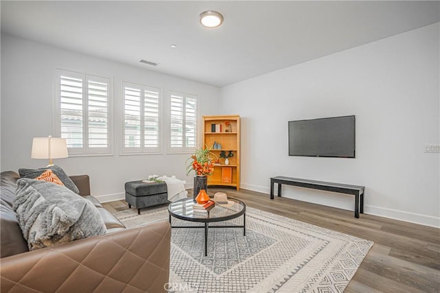 12931 Lotus St, Garden Grove, CA 92840 - living area with baseboards, visible vents, and wood finished floors