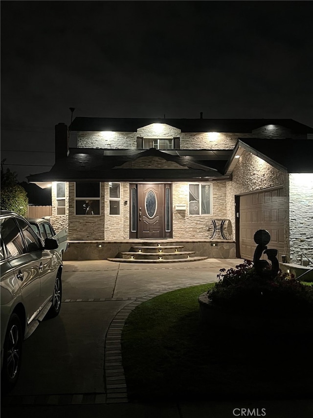 7650 El Vino Way, Buena Park, CA 90620 - view of front of house featuring stone siding and an attached garage