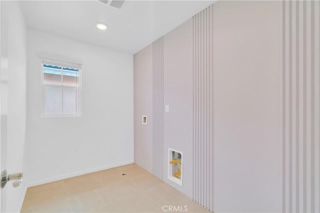 14667 Gulfstream Ln, Moreno Valley, CA 92553 - laundry area with light tile patterned floors, baseboards, and visible vents