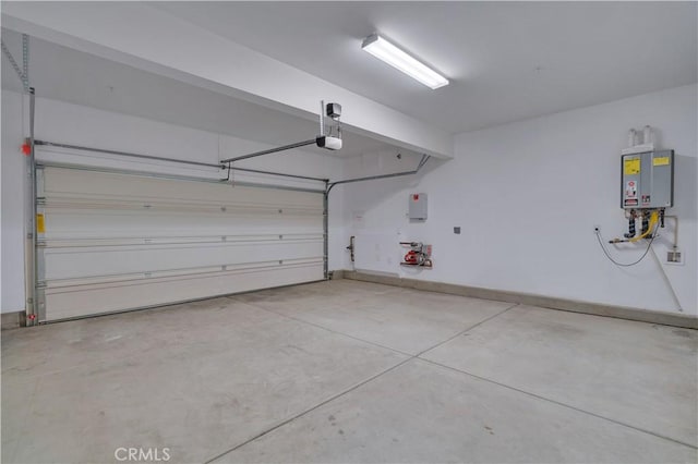 14667 Gulfstream Ln, Moreno Valley, CA 92553 - garage with tankless water heater and a garage door opener