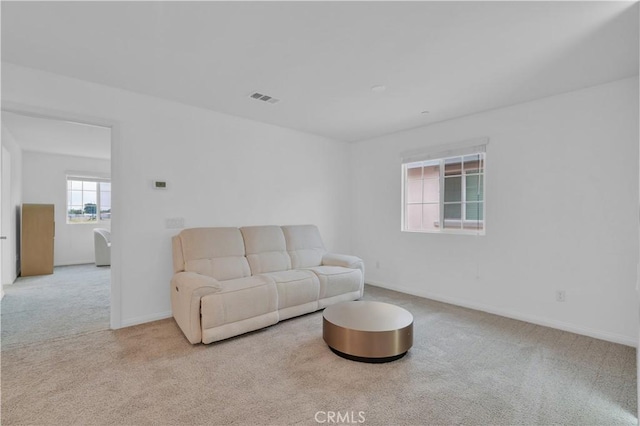 14667 Gulfstream Ln, Moreno Valley, CA 92553 - living area with baseboards, carpet flooring, and visible vents