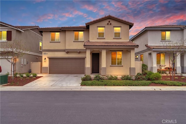 14667 Gulfstream Ln, Moreno Valley, CA 92553 - view of front facade featuring concrete driveway, stucco siding, a tiled roof, and an attached garage