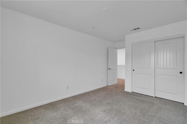 14667 Gulfstream Ln, Moreno Valley, CA 92553 - unfurnished bedroom with baseboards, a closet, visible vents, and carpet