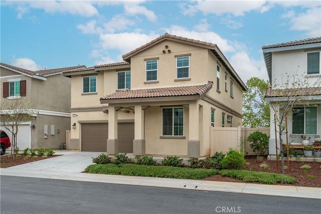 14667 Gulfstream Ln, Moreno Valley, CA 92553 - view of front facade with a tiled roof, fence, an attached garage, stucco siding, and concrete driveway