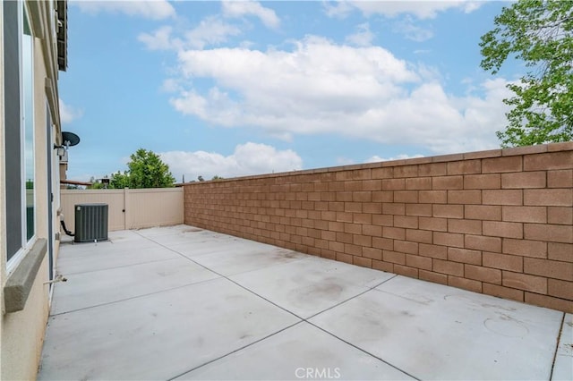 14667 Gulfstream Ln, Moreno Valley, CA 92553 - view of patio / terrace with central air condition unit and a fenced backyard