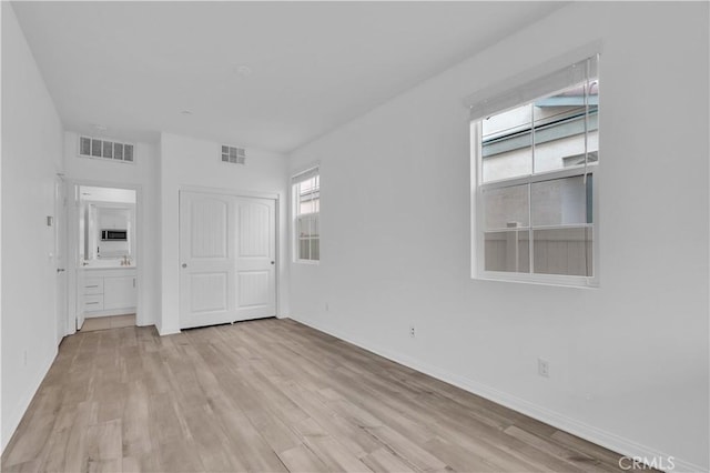 14667 Gulfstream Ln, Moreno Valley, CA 92553 - interior space featuring light wood-style flooring, baseboards, and visible vents