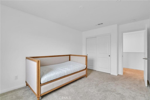 14667 Gulfstream Ln, Moreno Valley, CA 92553 - bedroom featuring baseboards, carpet flooring, a closet, and visible vents