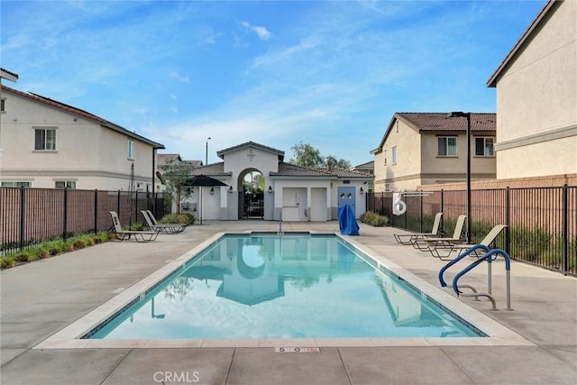 14667 Gulfstream Ln, Moreno Valley, CA 92553 - community pool featuring a patio area, fence, and a residential view