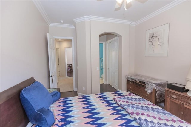1490 N Dewitt Ave, Clovis, CA 93619 - bedroom with wood finished floors, ornamental molding, ensuite bath, ceiling fan, and arched walkways