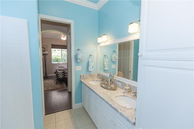 1490 N Dewitt Ave, Clovis, CA 93619 - bathroom featuring a sink, ornamental molding, baseboards, and tile patterned floors