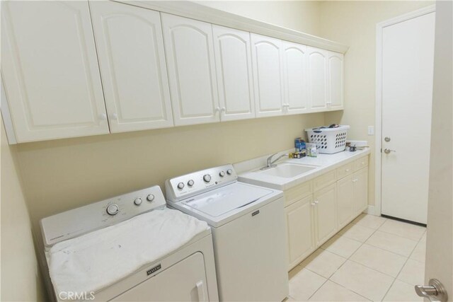 1490 N Dewitt Ave, Clovis, CA 93619 - washroom with a sink, light tile patterned flooring, cabinet space, and independent washer and dryer
