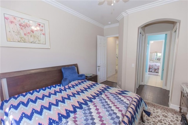 1490 N Dewitt Ave, Clovis, CA 93619 - bedroom with ornamental molding, arched walkways, baseboards, and wood finished floors