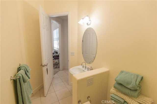 1490 N Dewitt Ave, Clovis, CA 93619 - bathroom with baseboards, tile patterned floors, and a sink