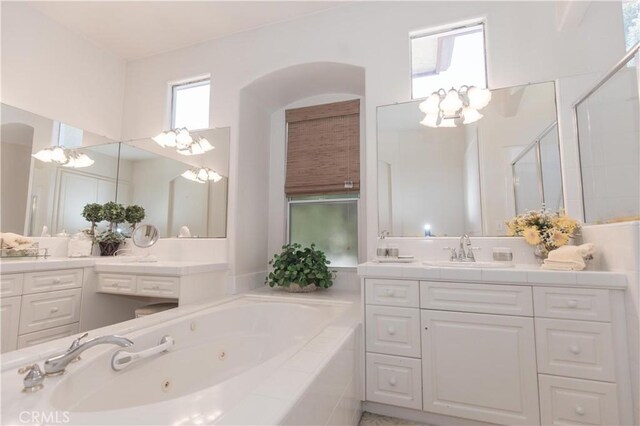 1490 N Dewitt Ave, Clovis, CA 93619 - full bath with a tub with jets, an inviting chandelier, a shower stall, and vanity