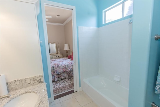 1490 N Dewitt Ave, Clovis, CA 93619 - ensuite bathroom featuring a sink, ensuite bathroom, ornamental molding, tile patterned flooring, and tub / shower combination