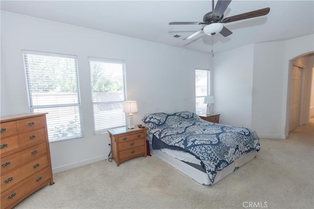 1490 N Dewitt Ave, Clovis, CA 93619 - bedroom with arched walkways, baseboards, visible vents, and light colored carpet