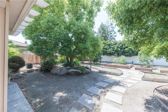 1490 N Dewitt Ave, Clovis, CA 93619 - exterior space featuring a garden and fence