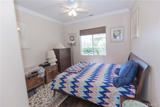 1490 N Dewitt Ave, Clovis, CA 93619 - bedroom with crown molding, ceiling fan, visible vents, and wood finished floors