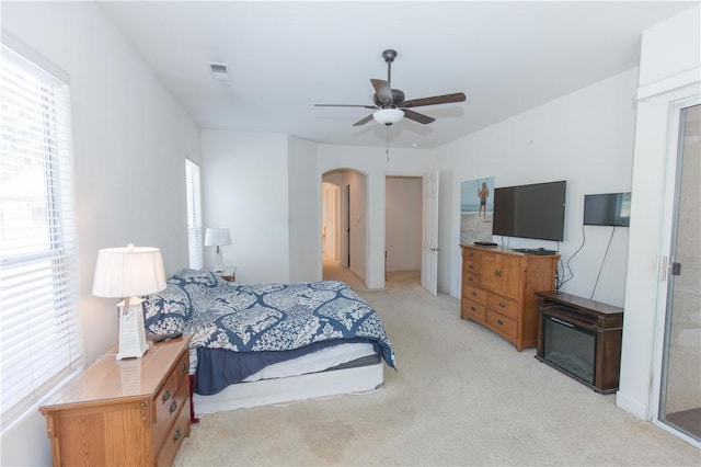 1490 N Dewitt Ave, Clovis, CA 93619 - bedroom with arched walkways, ceiling fan, visible vents, and light colored carpet