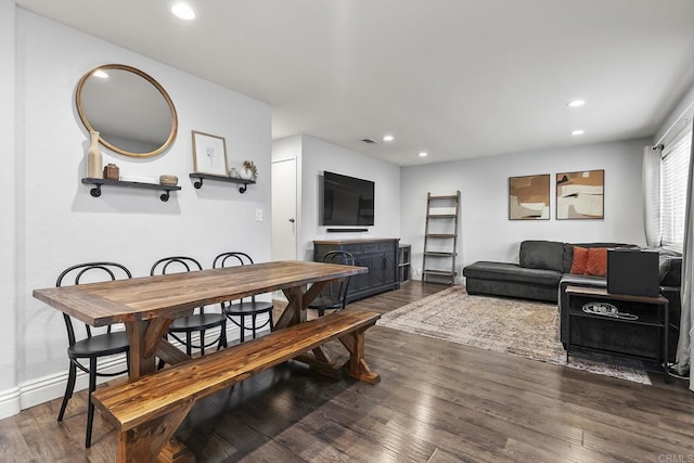 dining space featuring wood finished floors, visible vents, and recessed lighting