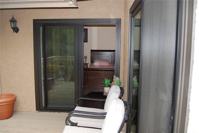 property entrance featuring stucco siding