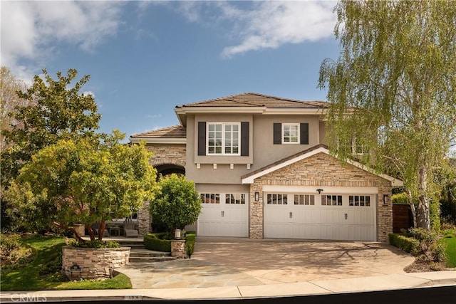 184 Halsbury Ct, Lake Sherwood, CA 91361 - view of front of home with stone siding, stucco siding, a garage, and driveway
