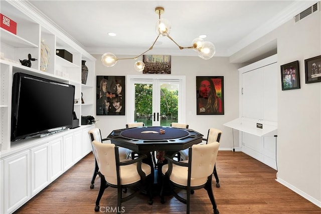 184 Halsbury Ct, Lake Sherwood, CA 91361 - recreation room with wood finished floors, ornamental molding, visible vents, a chandelier, and baseboards