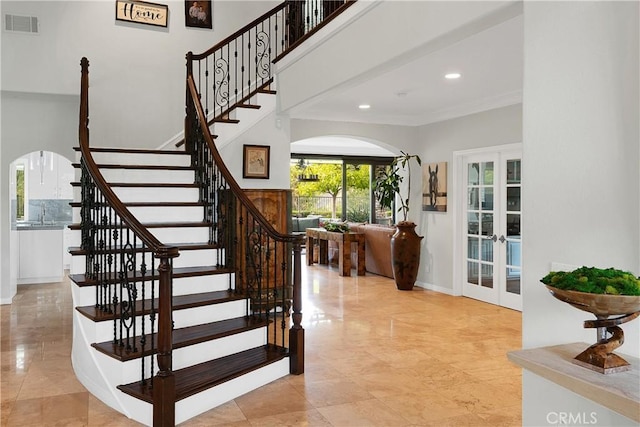 184 Halsbury Ct, Lake Sherwood, CA 91361 - stairs featuring french doors, recessed lighting, ornamental molding, visible vents, and arched walkways