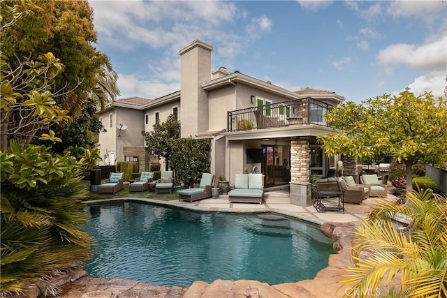 184 Halsbury Ct, Lake Sherwood, CA 91361 - rear view of property with an outdoor pool, a balcony, a patio, stucco siding, and a chimney