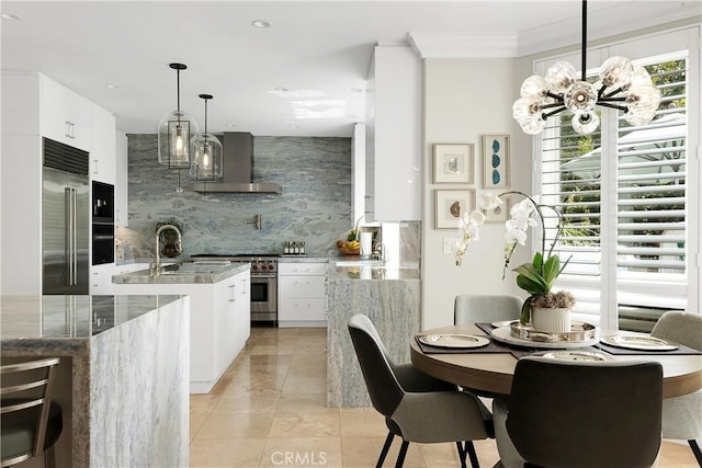 184 Halsbury Ct, Lake Sherwood, CA 91361 - kitchen featuring wall chimney exhaust hood, white cabinets, a kitchen island with sink, premium appliances, and backsplash