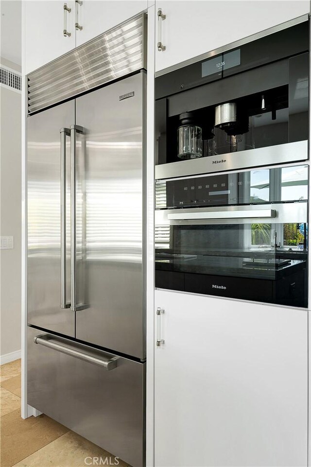 184 Halsbury Ct, Lake Sherwood, CA 91361 - kitchen with white cabinets and appliances with stainless steel finishes