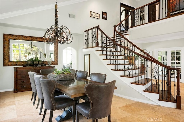 184 Halsbury Ct, Lake Sherwood, CA 91361 - dining area with a high ceiling, visible vents, arched walkways, and stairs