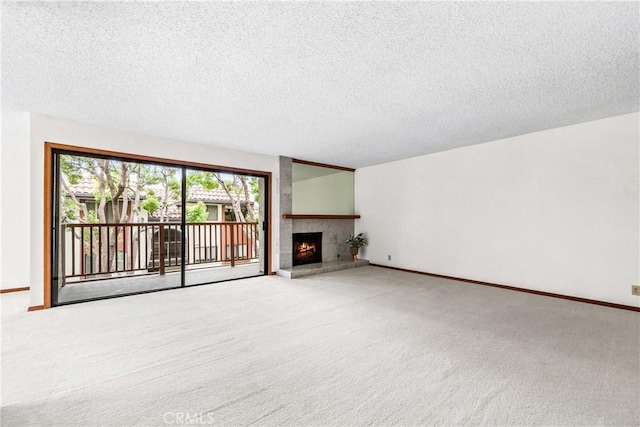 unfurnished living room with a textured ceiling and carpet
