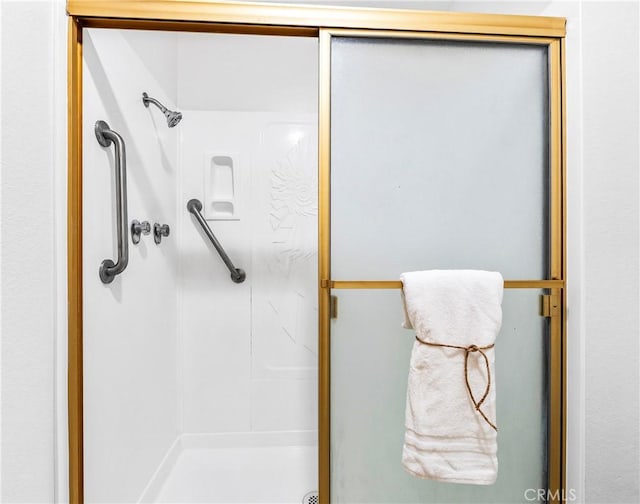bathroom featuring a shower stall